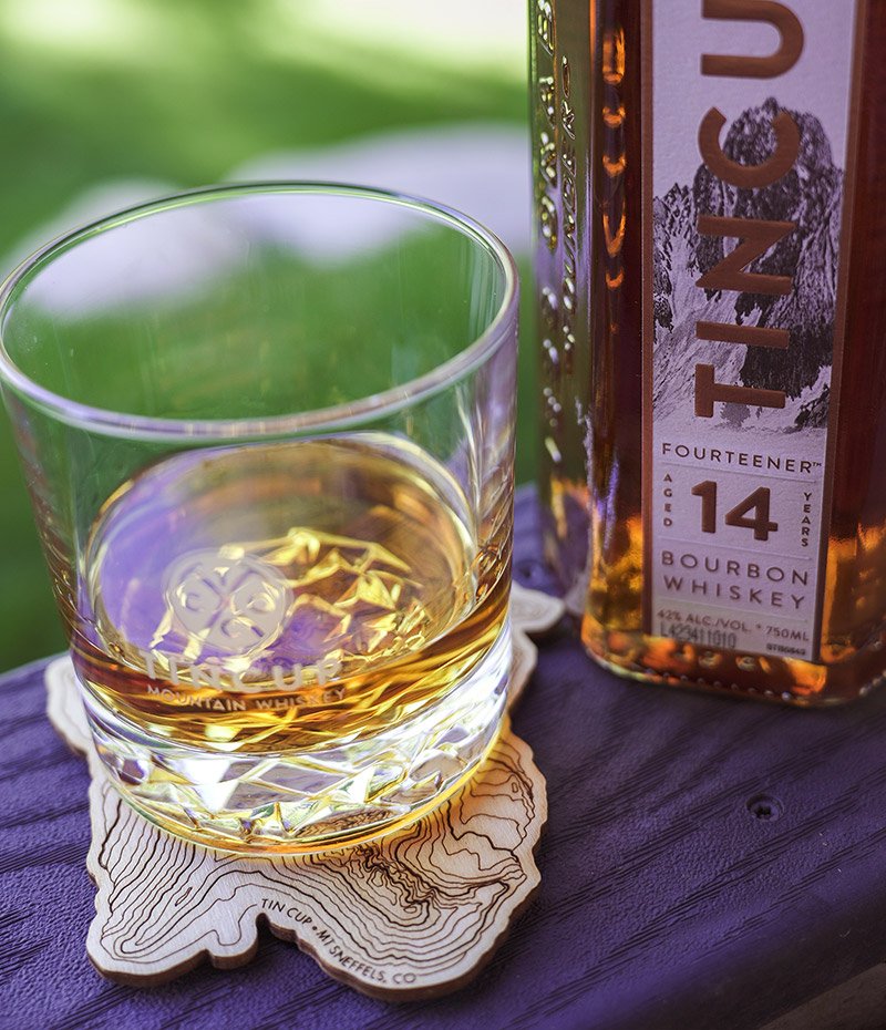 TINCUP Fourteener Bourbon glass on a coaster